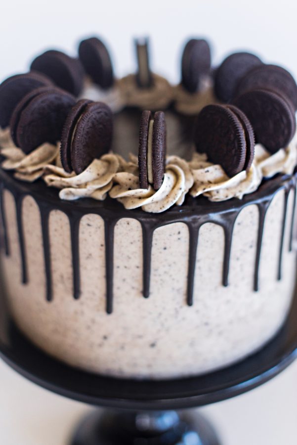 The Best Ever Cookies and Cream Cake with chocolate cake layers, cookies and cream filling, Oreo buttercream and a chocolate drip. #cakebycourtney #cake #cakes #oreocake #cookiesandcreamcake #oreo