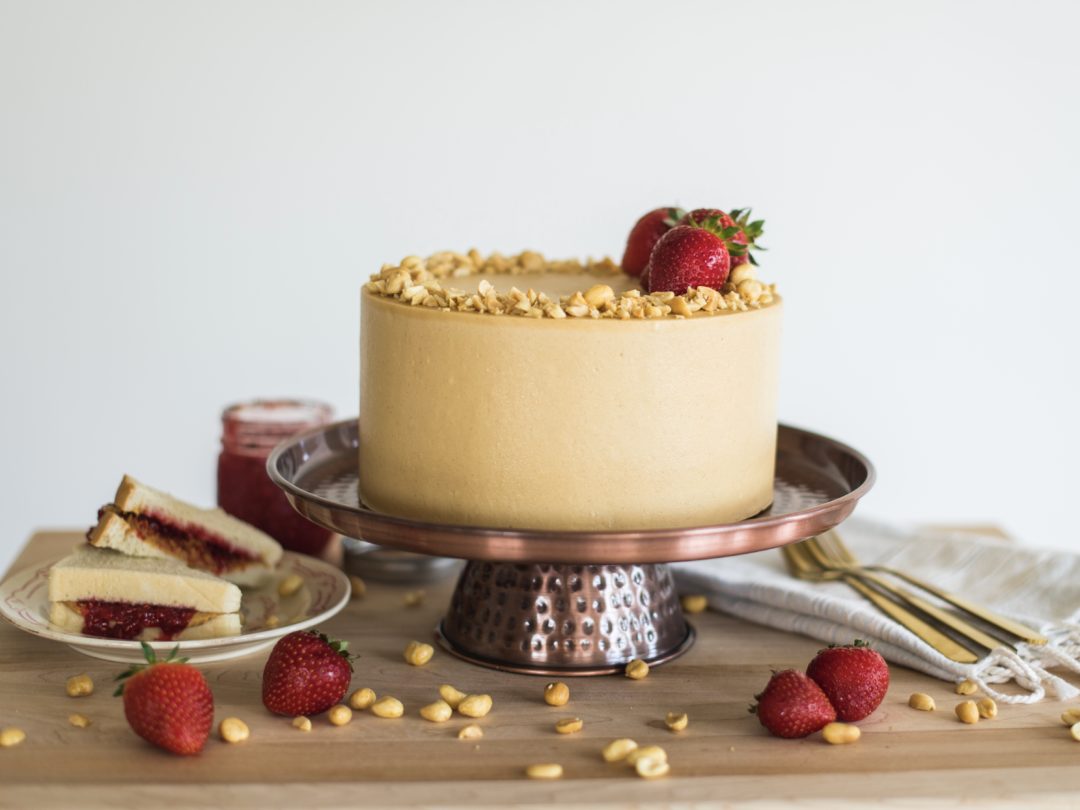 Peanut Butter and Jelly Cake on a cake stand