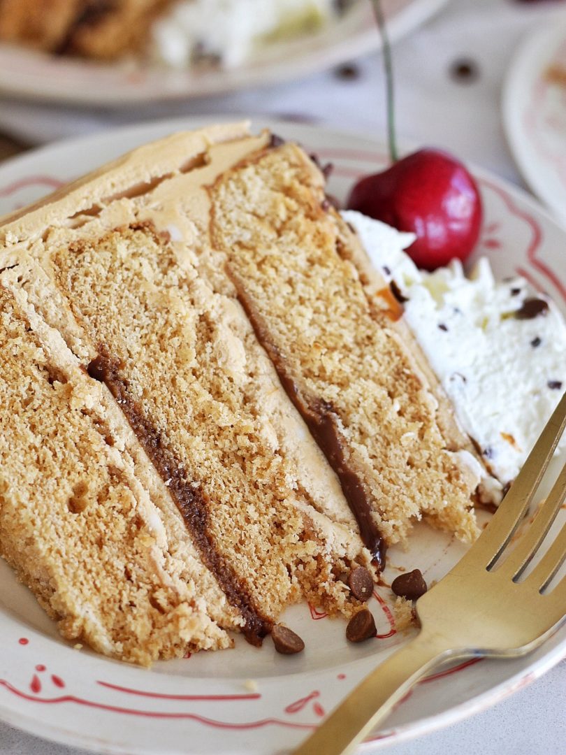 Slice of Root Beer Float Cake on a plate.