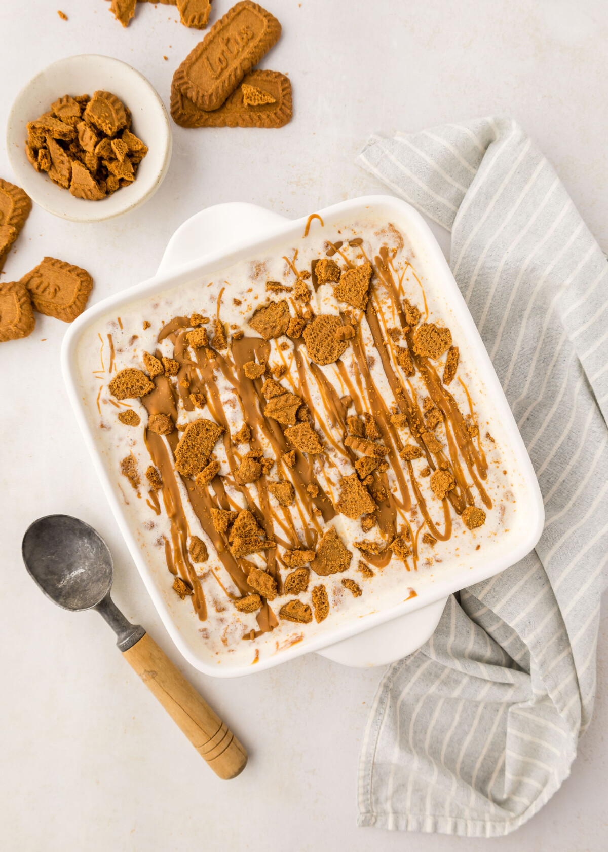 Biscoff ice cream in a white dish.