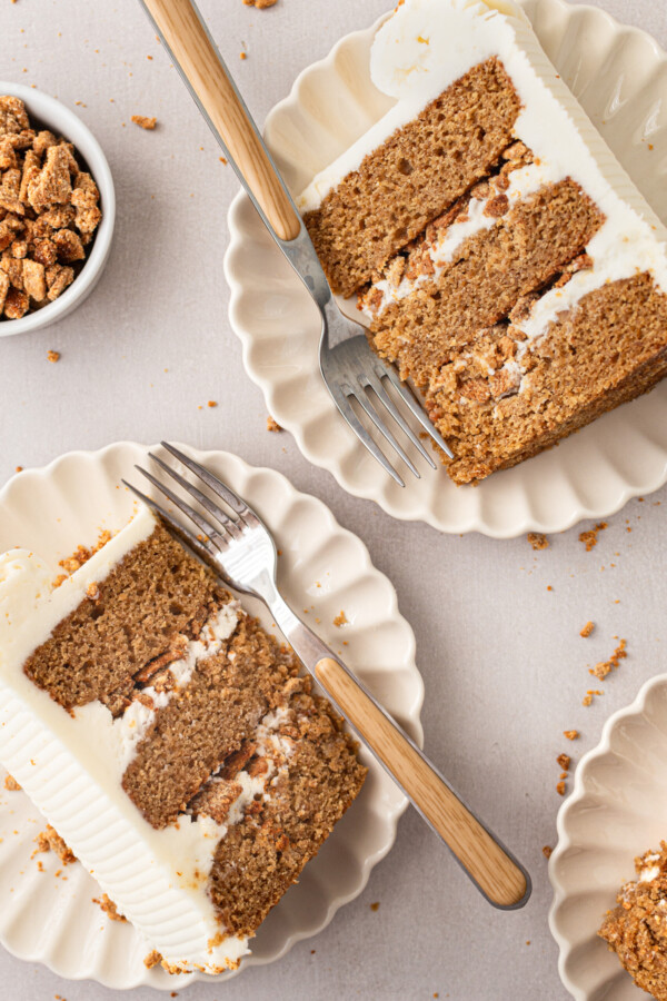 Two slices of cake on a plate.