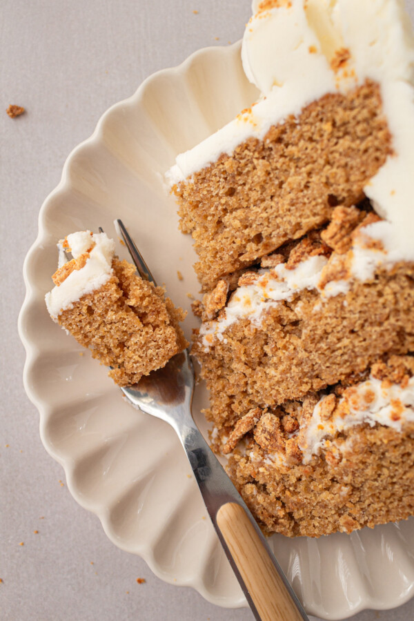 A slice of cake with a bite taken out of it.