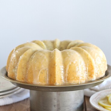 Lemon Poppy Seed Bundt Cake - tender and moist lemon poppy seed cake with a lemon butter glaze #cakebycourtney #cake #lemonbundtcake #lemonpoppyseedcake #lemonpoppyseedbundtcake #easylemoncake #easybundtcake #lemoncake #thebestlemonpoppyseedbundtcake #thebestlemoncake #lemondessert