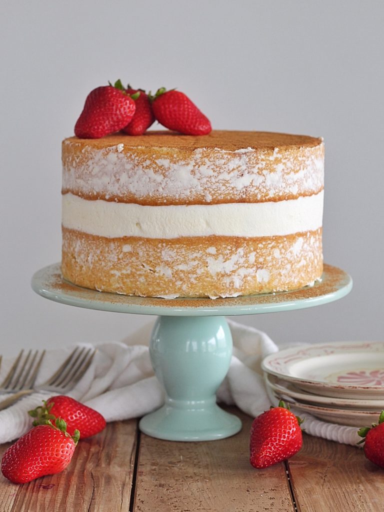 Tres Leches Cake - vanilla sponge cake with a cinnamon soak, whipped cream and fresh strawberries. #cakebycourtney #treslechescake #layeredtreslechescake #cincodemayocake #cincodemayo 