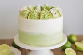 Mojito Cake: tender and fluffy white cake layers infused with lime and mint, with a lime curd and mint buttercream. #cakebycourtney #mojitocake #summercake #cake #cakerecipe #easycakerecipe #mojito