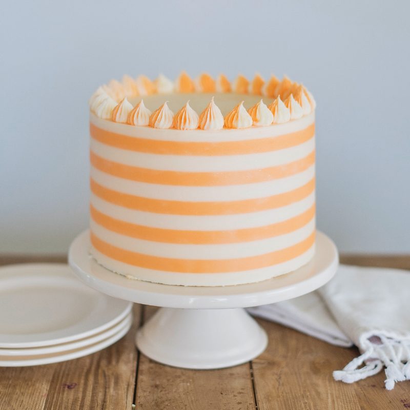 Creamsicle Cake: orange cream cake layers, filling and buttercream #cakebycourtney #cake #creamsiclecake #creamsicle #orangecreamcake #cakerecipe #summercakerecipe