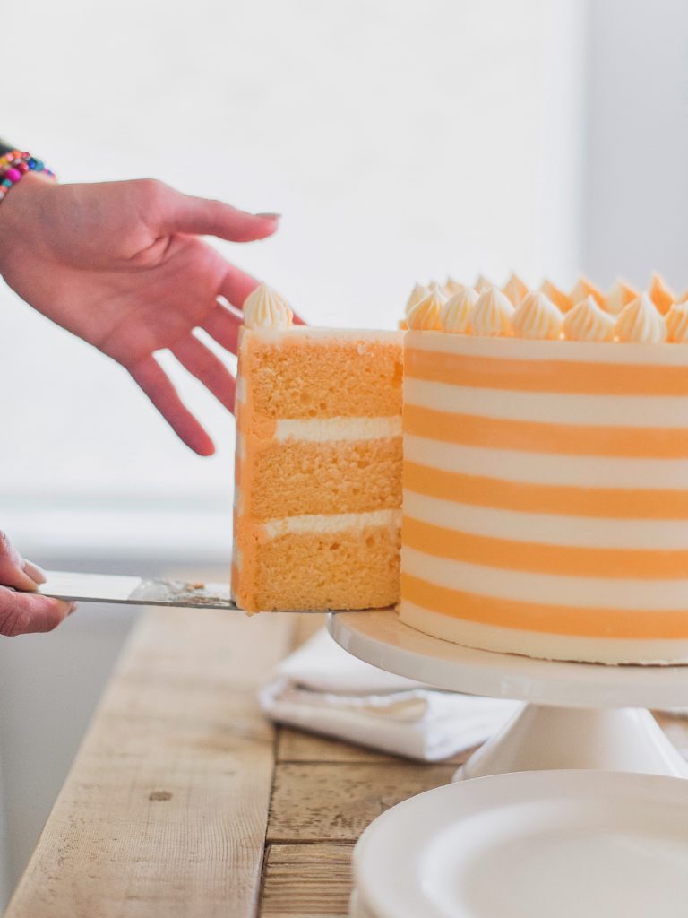 Creamsicle Cake: orange cream cake layers, filling and buttercream #cakebycourtney #cake #creamsiclecake #creamsicle #orangecreamcake #cakerecipe #summercakerecipe