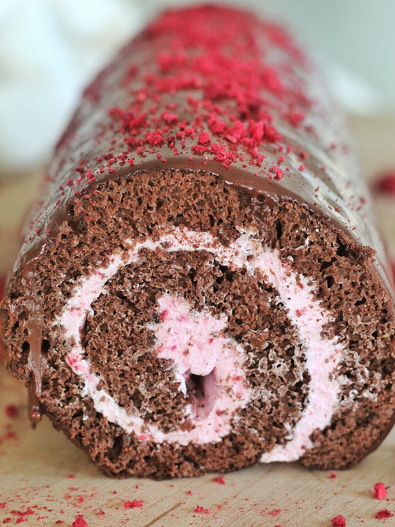 Chocolate Raspberry Swiss Roll - chocolate sponge cake with raspberry whipped cream and chocolate ganache. #cakebycourtney #cake #swissroll #spongecake #cakerollrecipe #cakeroll #howtomakeacakeroll #raspberry #whippedcream