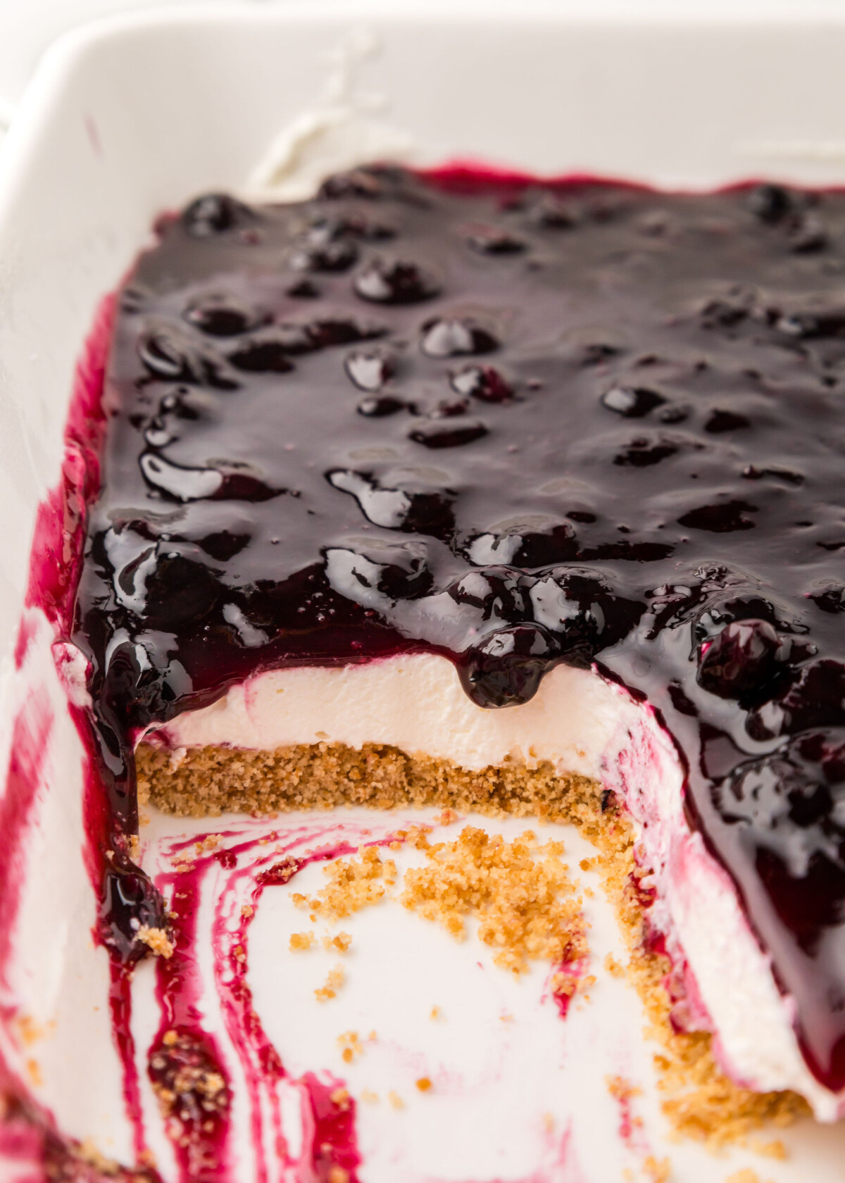 A pan of no-bake dessert bars with blueberries on top.