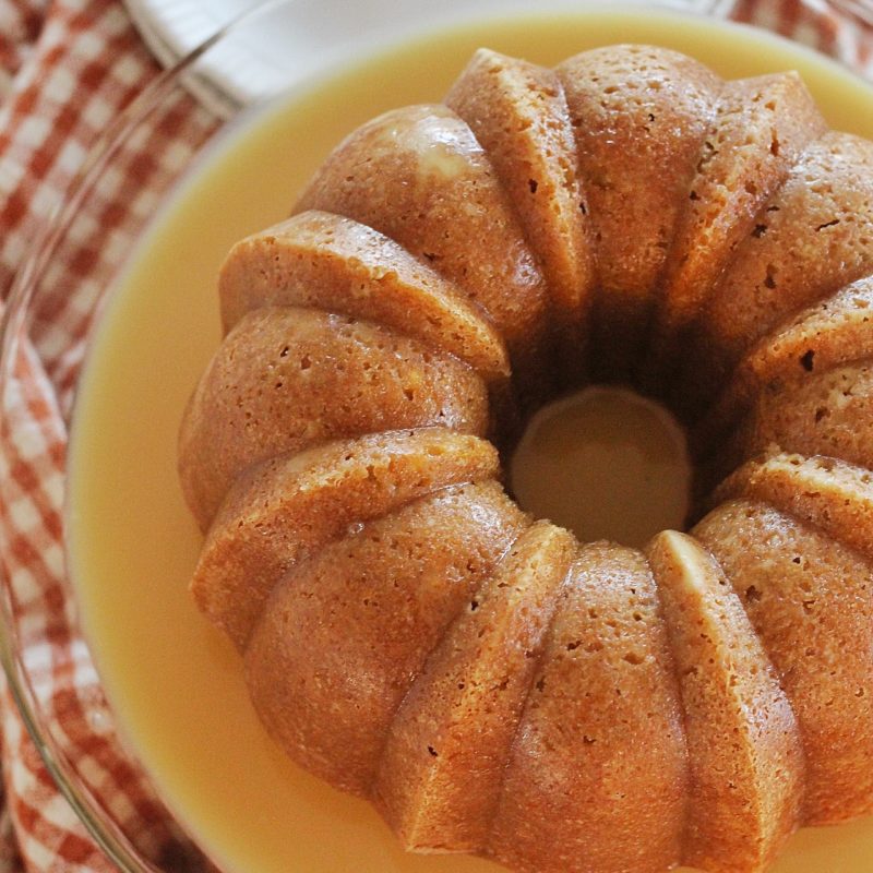 Pumpkin Bundt Cake with Butter Rum Sauce: a moist and flavorful pumpkin cake with a butter rum sauce. #fallcake #cakebycourtney #pumpkincake #bundtcake #pumpkinbundtcake #easybundtcake #easycakerecipe #buttersauce #pumpkindessert
