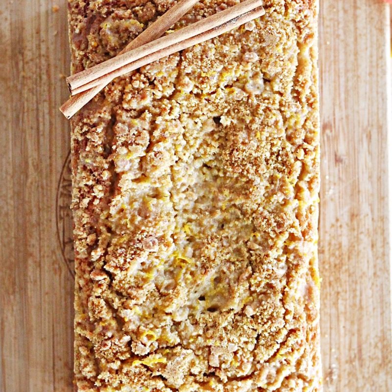 Wassail Crumble Cake - a delicious orange, apple, cinnamon cake loaf with an orange cinnamon crumble and orange glaze. #christmascake #christmascakerecipe #christmasdessertrecipe #christmascakeideas #christmascakeflavors #easychristmascake #christmasdessertideas #easycrhistmasdesserts #christmasdesserts #cakebycourtney #bestholidaycakes