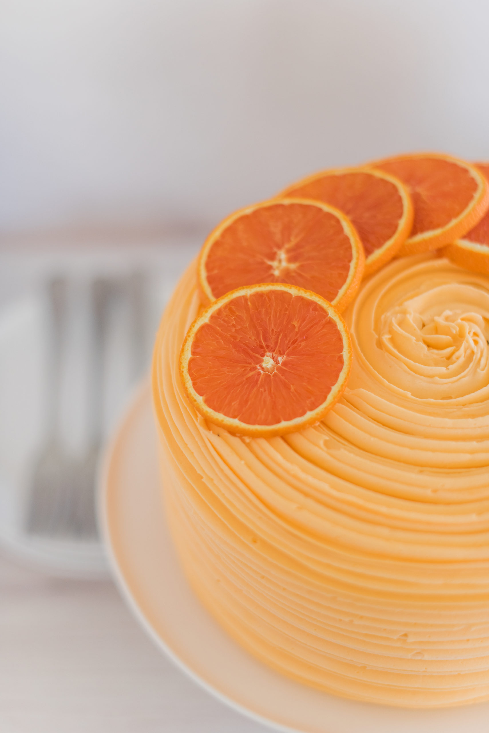Orange Almond Poppy Seed Cake - light and fluffy poppy seed cake layers, infused with orange and almond flavoring, topped with almond buttercream and orange curd. #cakebycourtney #almondcake #almondpoppyseedcake #orangealmondpoppyseedcake #orangecurd #almondbuttercream #summercake #summerdessertrecipe #summerdessert #poppyseedcake #lightandfluffycake #cakedesign #cakerecipes #cakesforgirlsbirthday #cakeaesthetic #cakeideas #cakedecorating