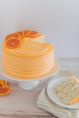 Orange Almond Poppy Seed Cake - light and fluffy poppy seed cake layers, infused with orange and almond flavoring, topped with almond buttercream and orange curd. #cakebycourtney #almondcake #almondpoppyseedcake #orangealmondpoppyseedcake #orangecurd #almondbuttercream #summercake #summerdessertrecipe #summerdessert #poppyseedcake #lightandfluffycake #cakedesign #cakerecipes #cakesforgirlsbirthday #cakeaesthetic #cakeideas #cakedecorating