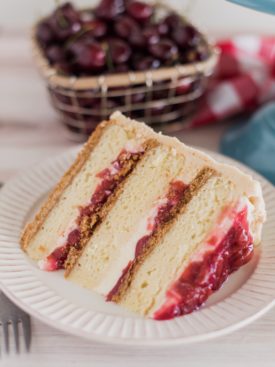 Cherry Cheese Pie Cake - dig into this delicious pie-inspired cake with layers of graham cracker, cream cheese cake, cheesecake filling, cherry pie filling and graham cracker buttercream. #cakebycourtney #cherrycheesepiecake #cherrypie #cherrycheesepie #bestsummercakerecipes #summercakerecipe #bestcakerecipes #summercakes #cherrypiecake #cherrydessert #summerdessert #howtomakebuttercreamfrosting #howtomakecake