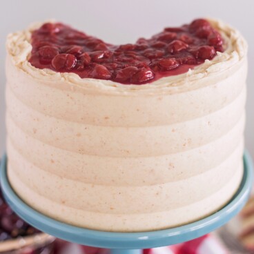 Cherry Cheese Pie Cake - dig into this delicious pie-inspired cake with layers of graham cracker, cream cheese cake, cheesecake filling, cherry pie filling and graham cracker buttercream. #cakebycourtney #cherrycheesepiecake #cherrypie #cherrycheesepie #bestsummercakerecipes #summercakerecipe #bestcakerecipes #summercakes #cherrypiecake #cherrydessert #summerdessert #howtomakebuttercreamfrosting #howtomakecake