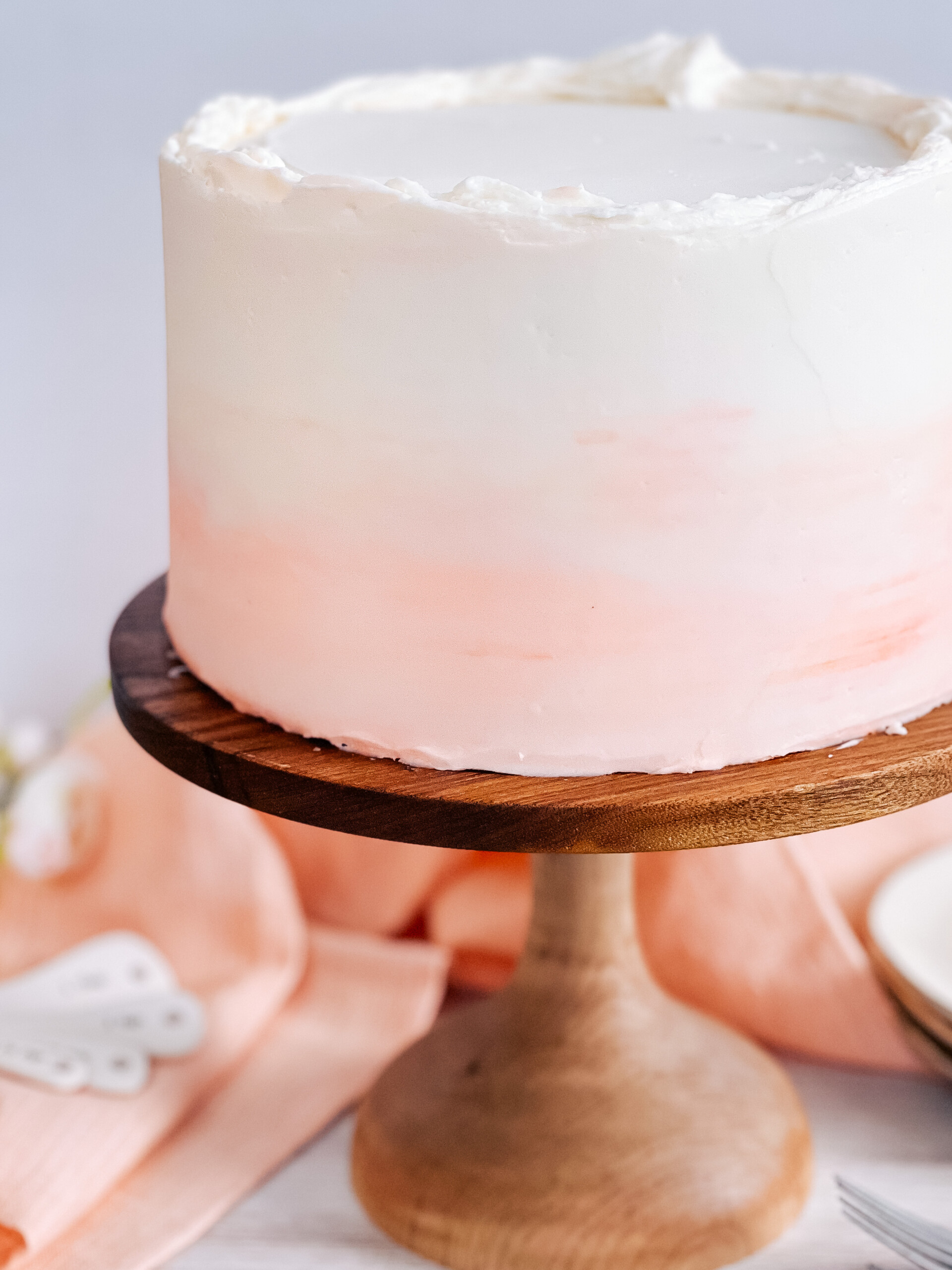 Ombre peach cake on cake stand