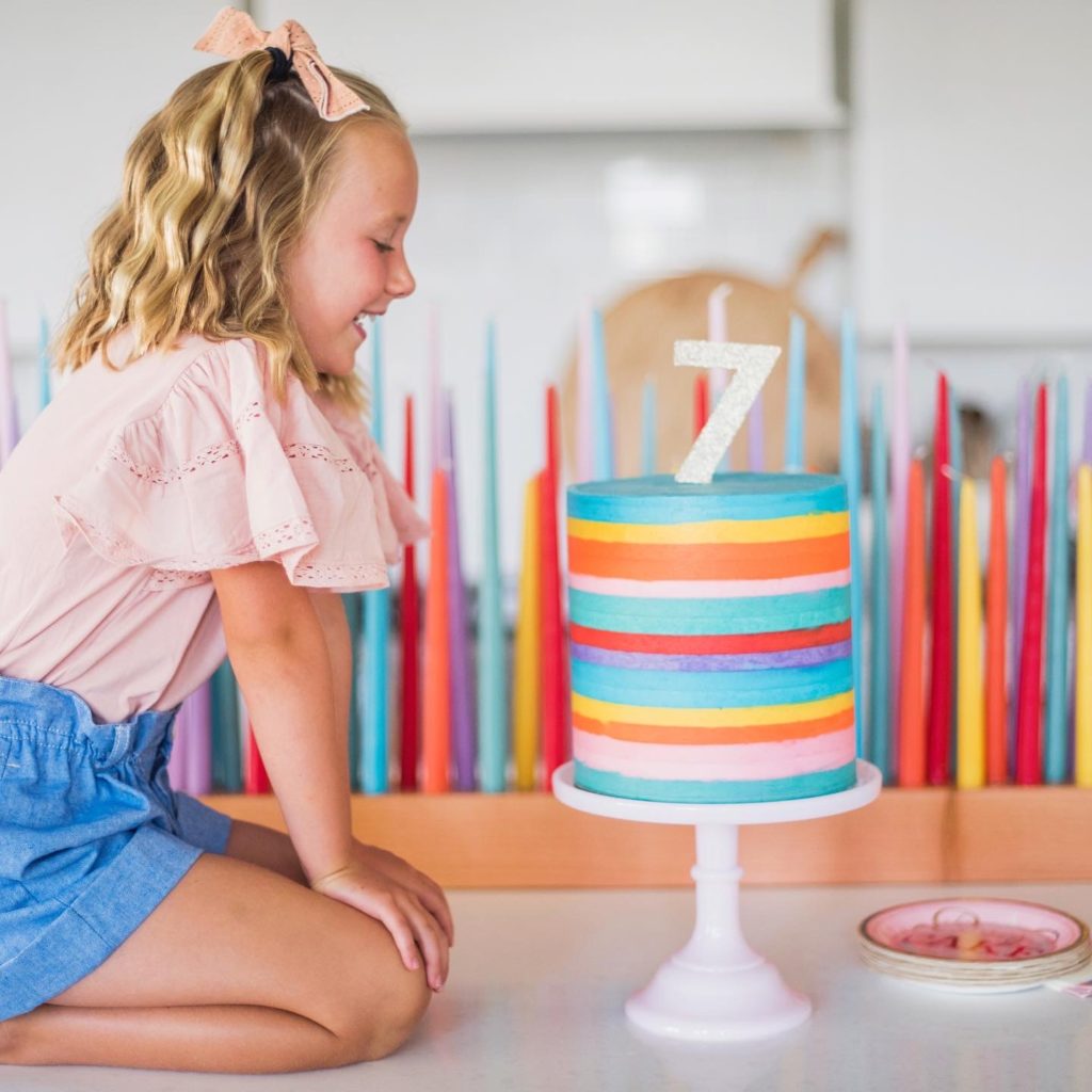 Striped Buttercream Rainbow Cake - this 8-inch round, 10-inch tall cake is the ultimate rainbow birthday cake #birthdaycake #rainbowcake #buttercreamcake