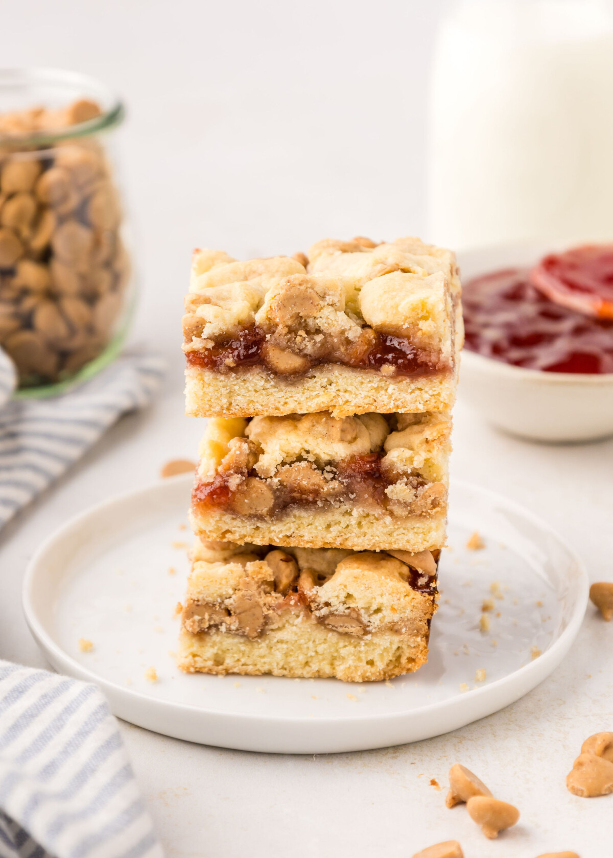 A stack of three peanut butter and jelly bars.