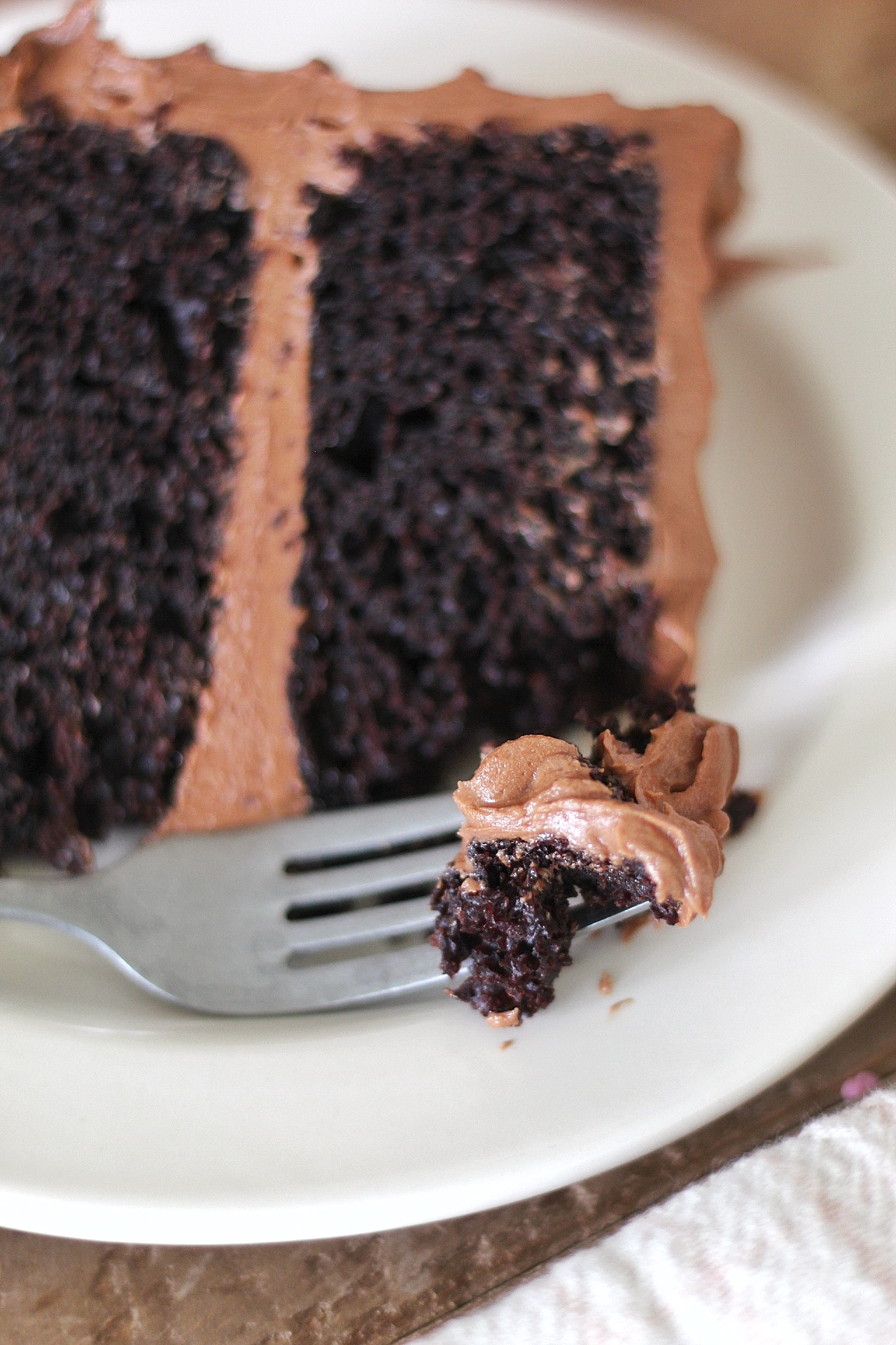 The Most Delicious Chocolate Cake - rich, moist and decadent chocolate cake layers with silky smooth chocolate buttercream #chocolatecake #bestchocolatecake #favoritechocolatecake #easychocolatecake #easychocolatecake #easychocolatecakerecipe #chocolatecakerecipe #chocolate #chocolateicing #icingrecipe #frostingrecipe #chocolatefrochocake #chocolatefrohowseasy #chocolate cake birthdaycake #howtomakebuttercreamfrosting