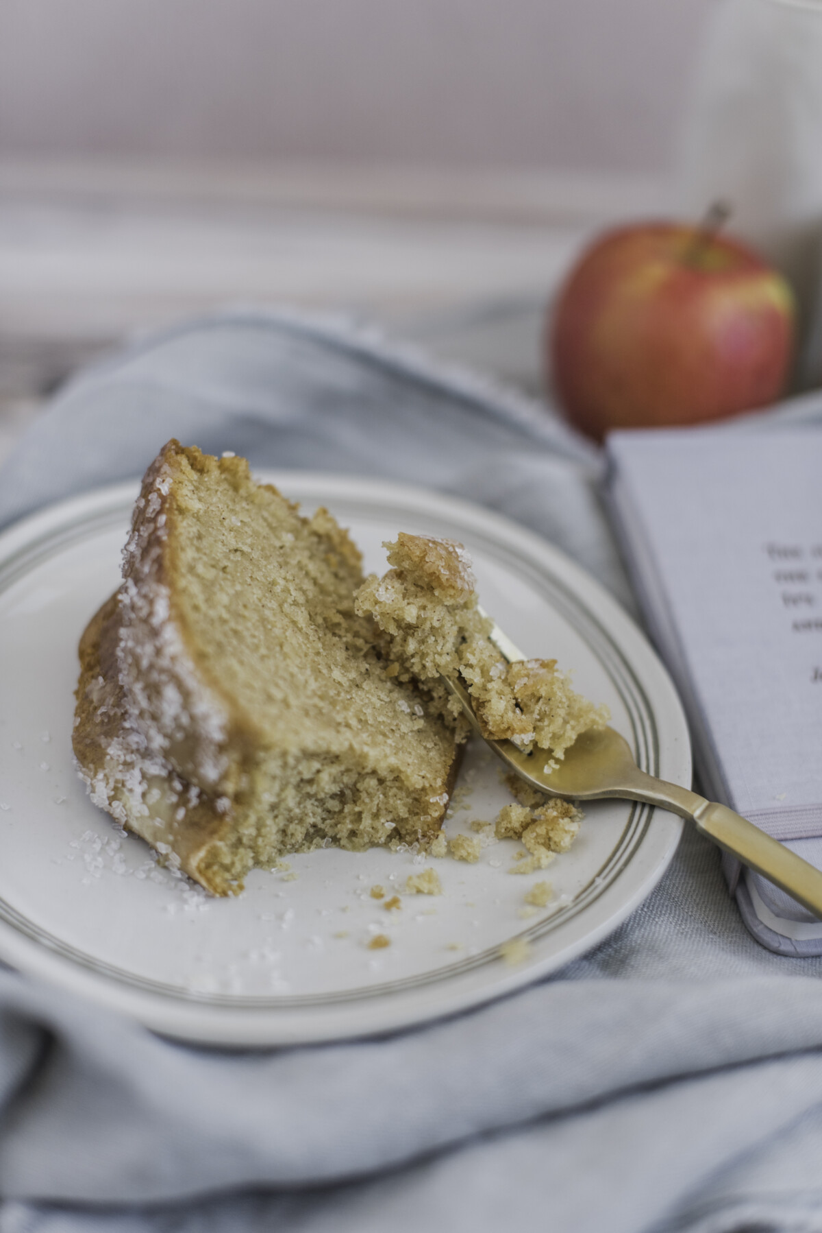 A slice of bundt cake with a bite taken out of it.