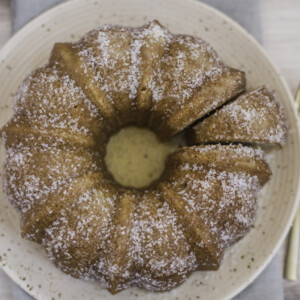 A bundt cake with a slice cut into it.