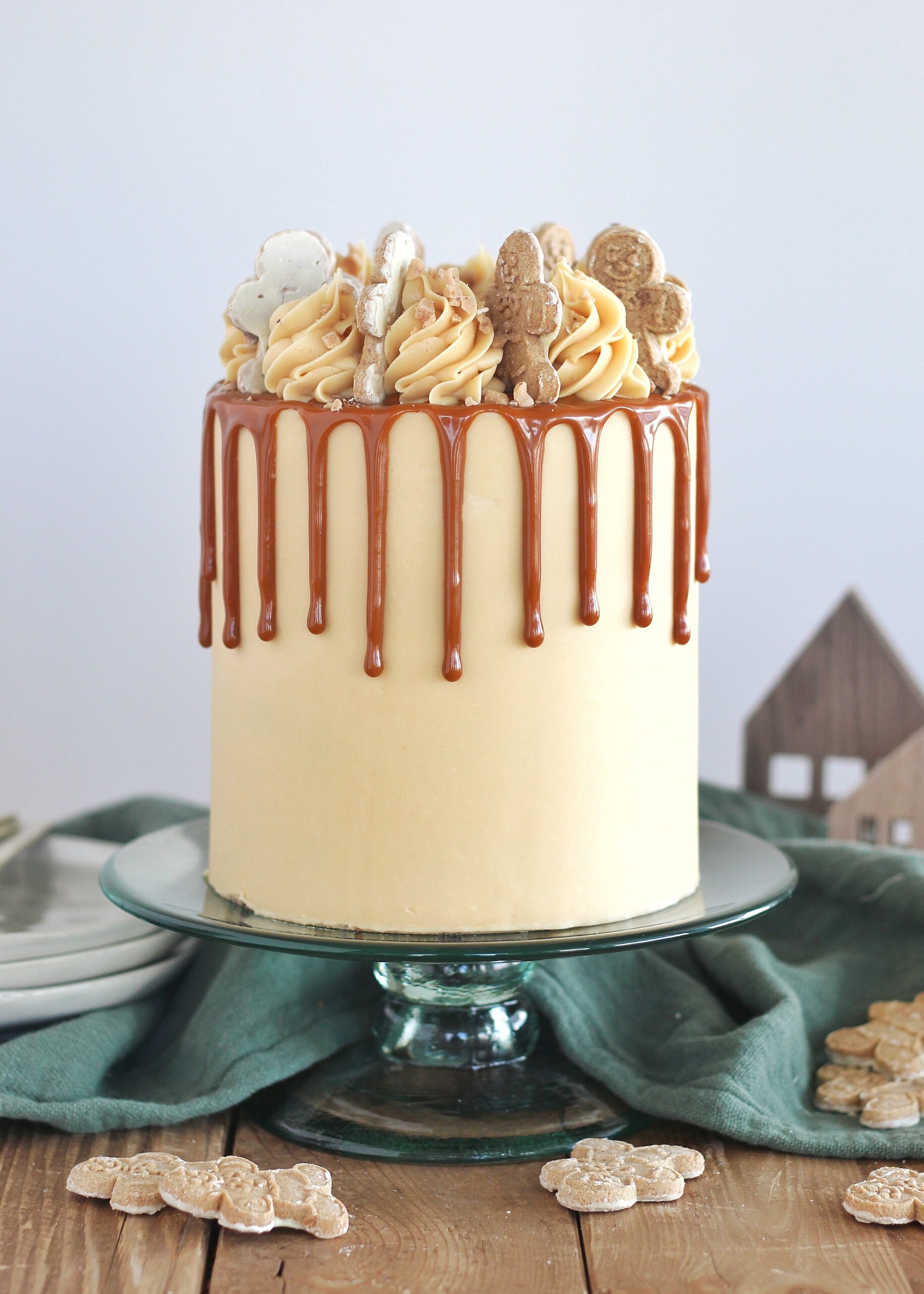 The most delicious gingerbread cake layers with salted caramel buttercream, caramel drip and toffee bits.