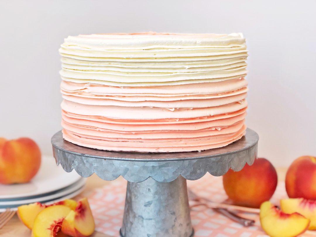 peaches and cream cake with moist cake layers. www.cakebycourtney.com