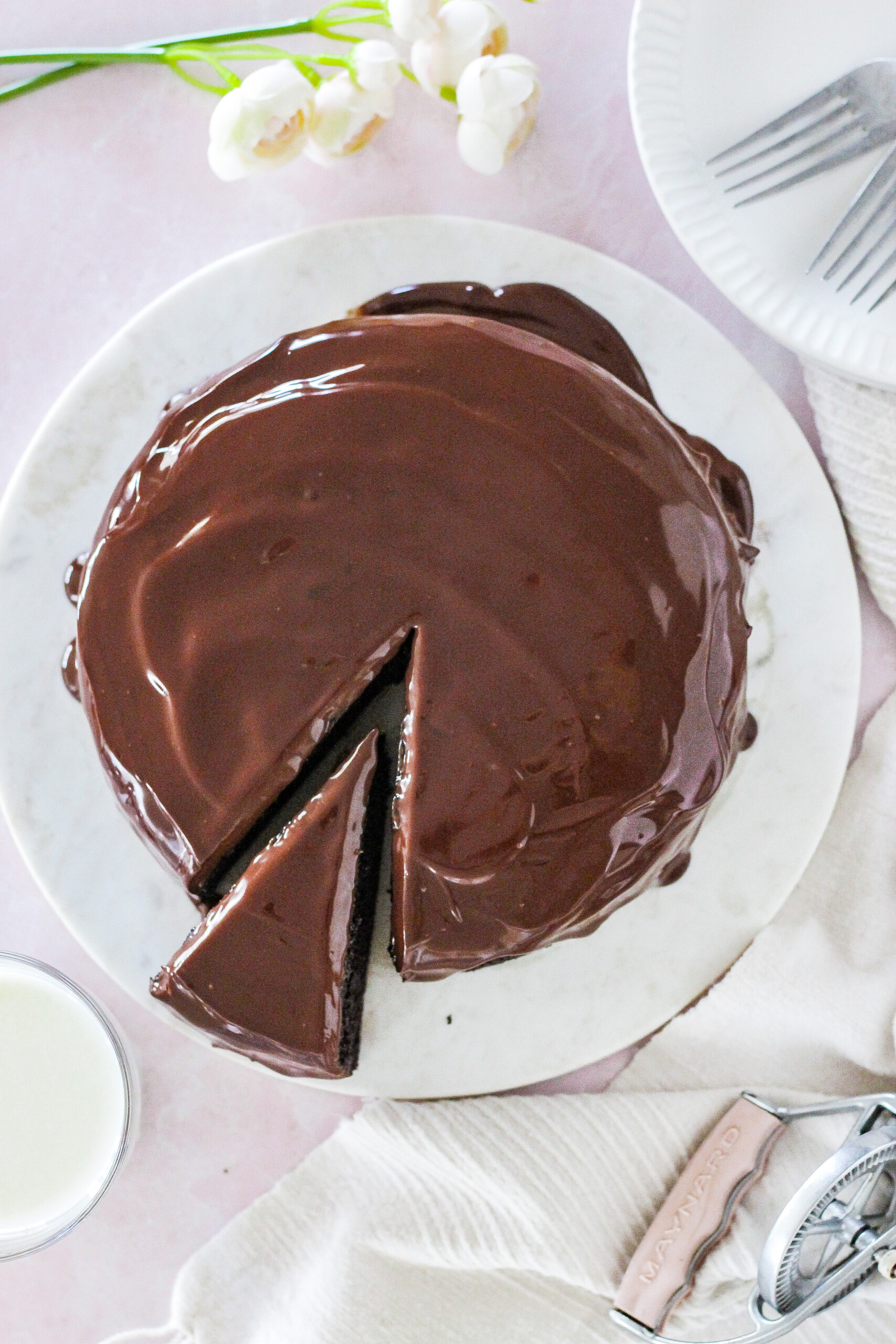 Top view of a chocolate cake with chocolate ganache on it.
