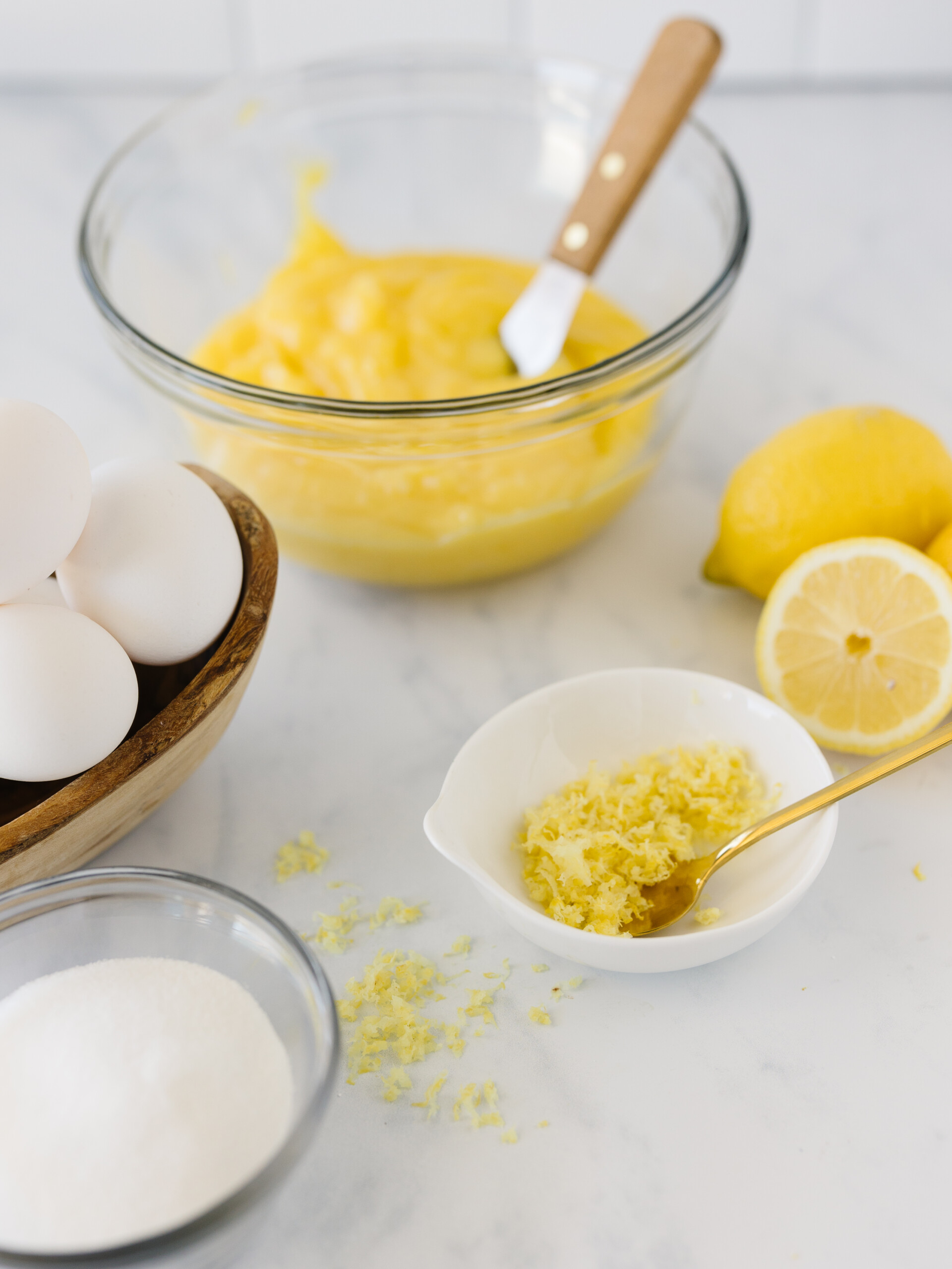 Ingredients to make lemon curd on a counter.