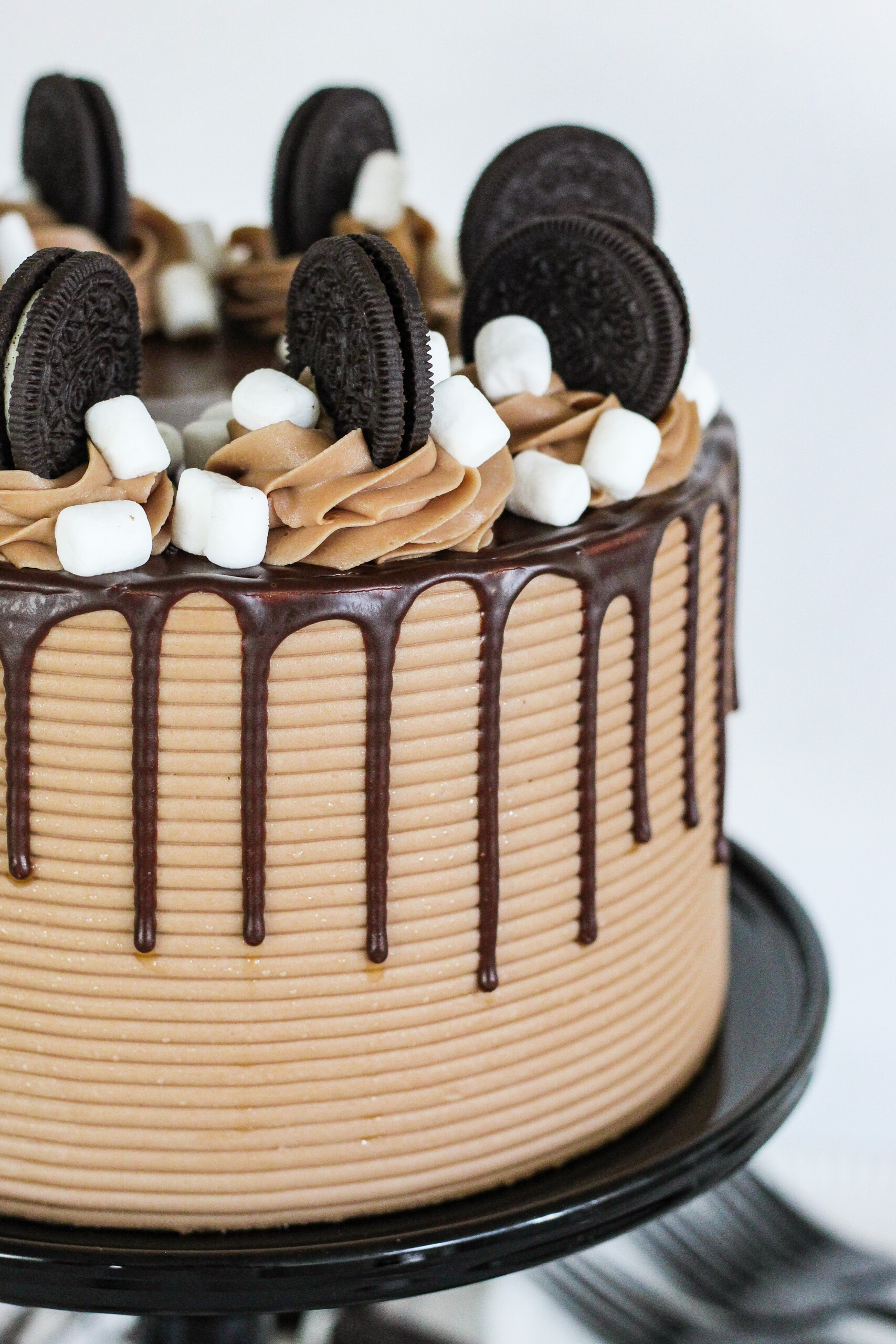 Close up of a chocolate drip on a chocolate cake.