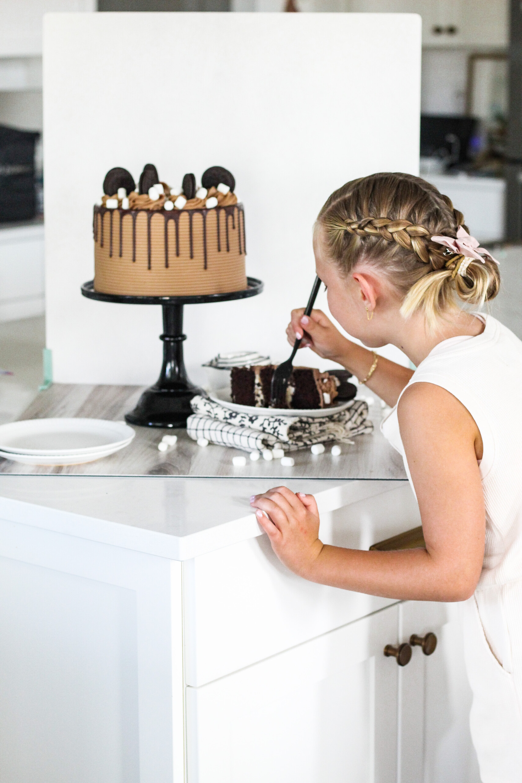 Girl eating chocolate cake.