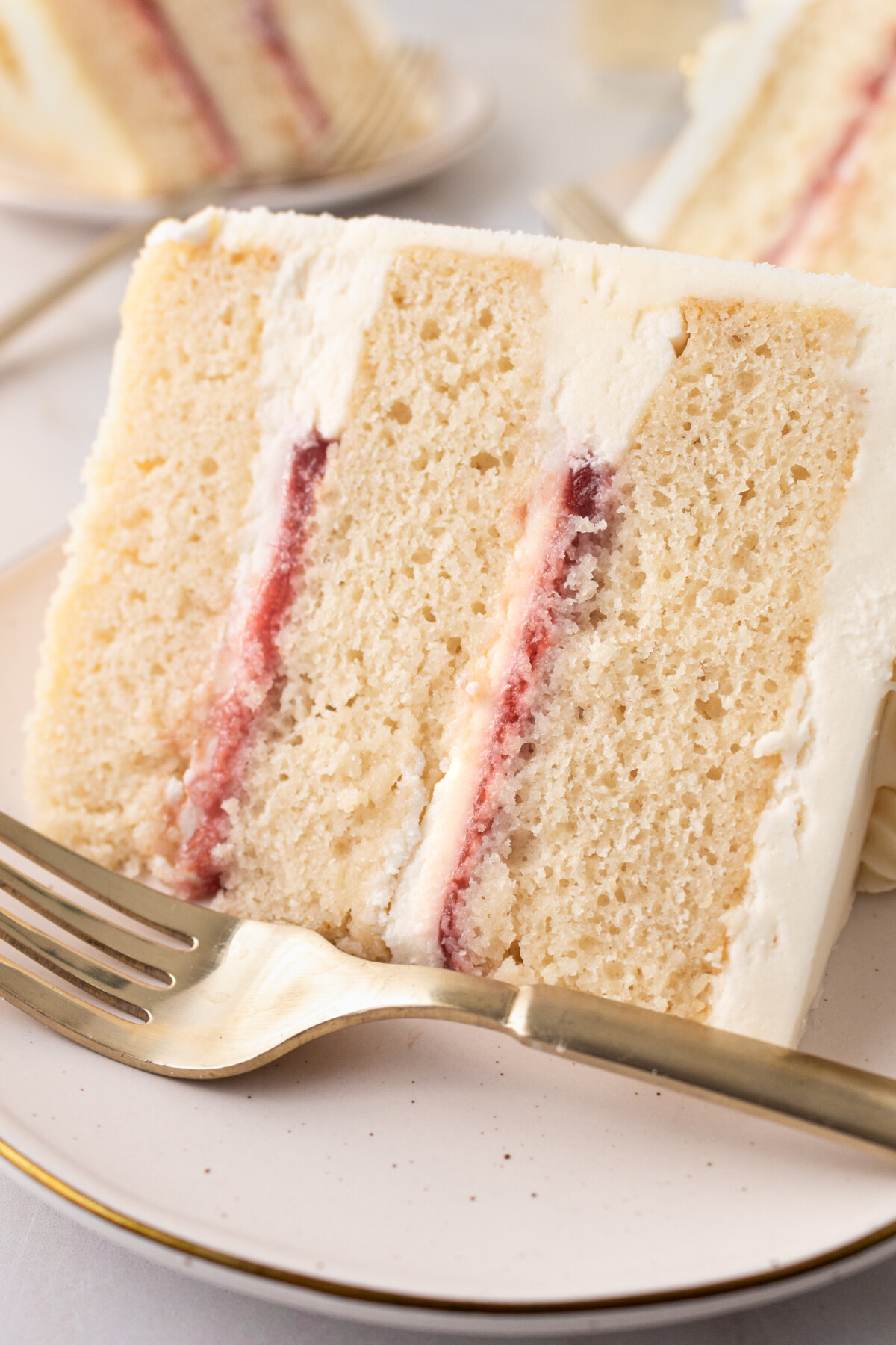 A slice of a cake on a plate with a fork.