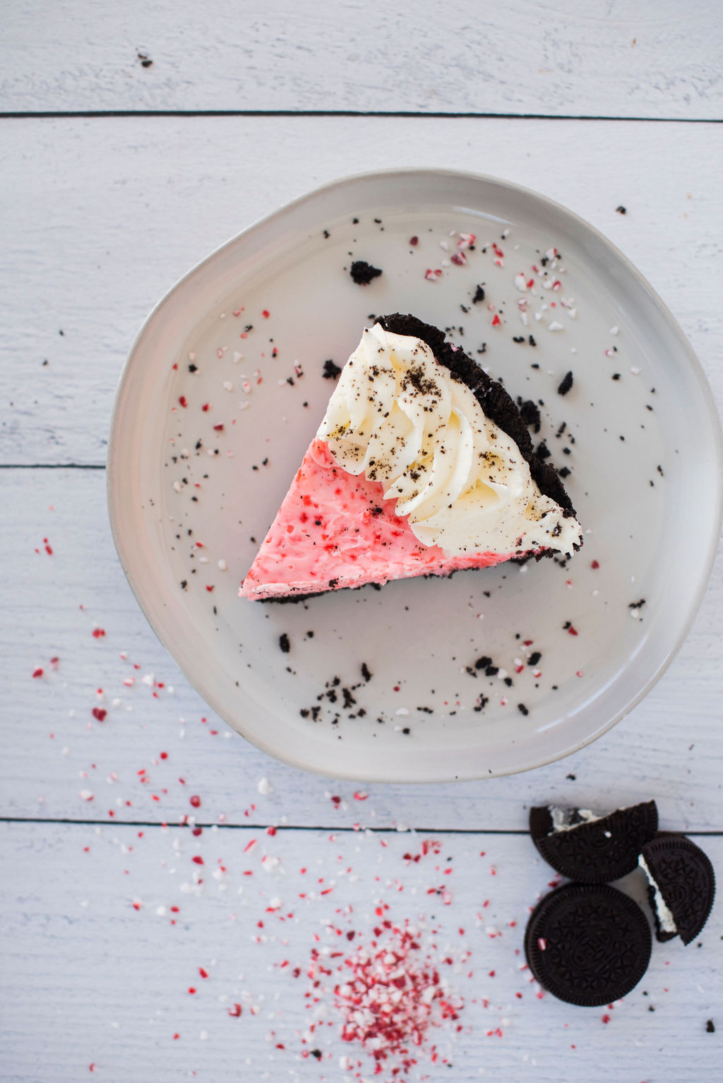 A slice of peppermint oreo pie on a plate.