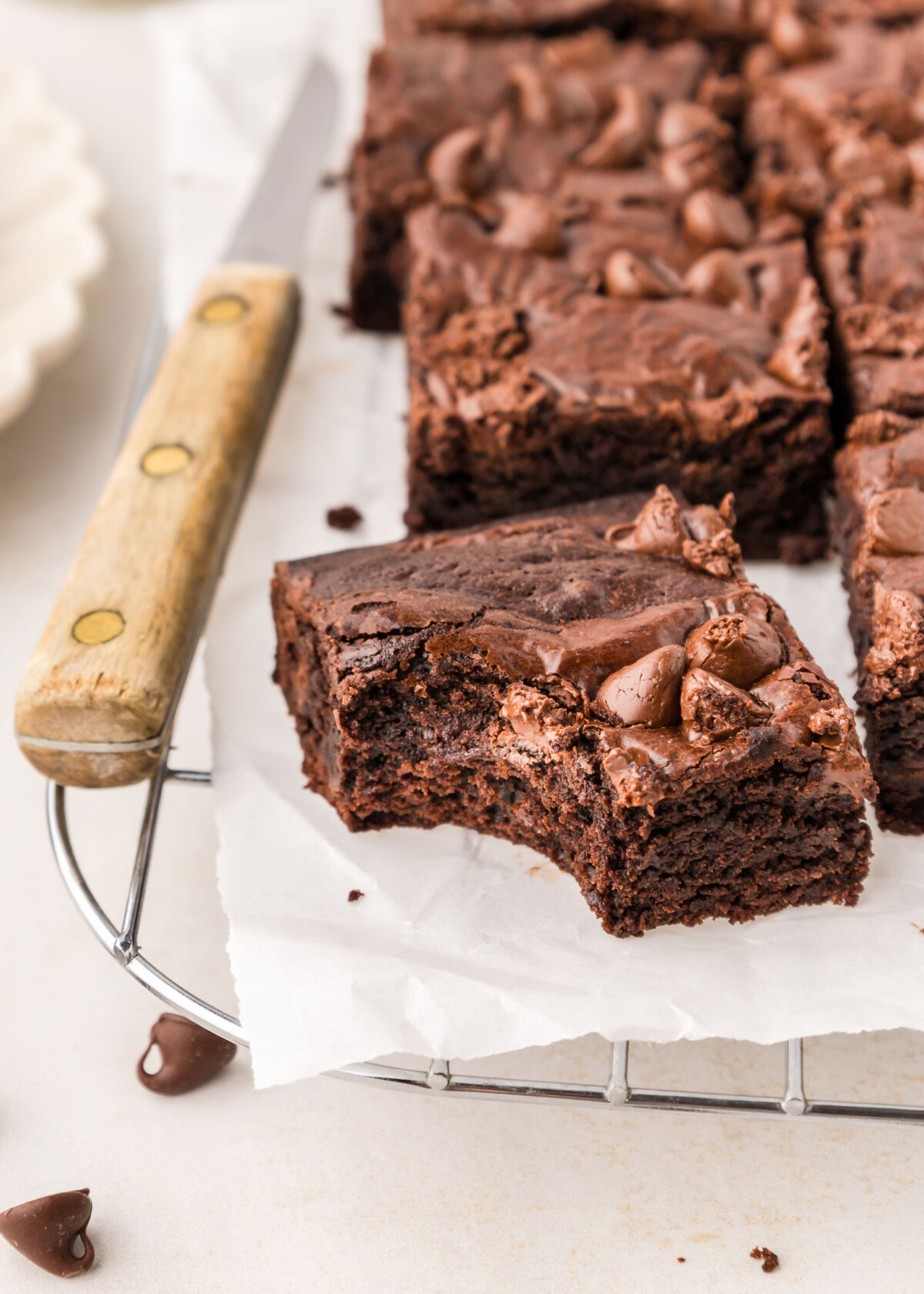 A brownie with a bite taken out of it.