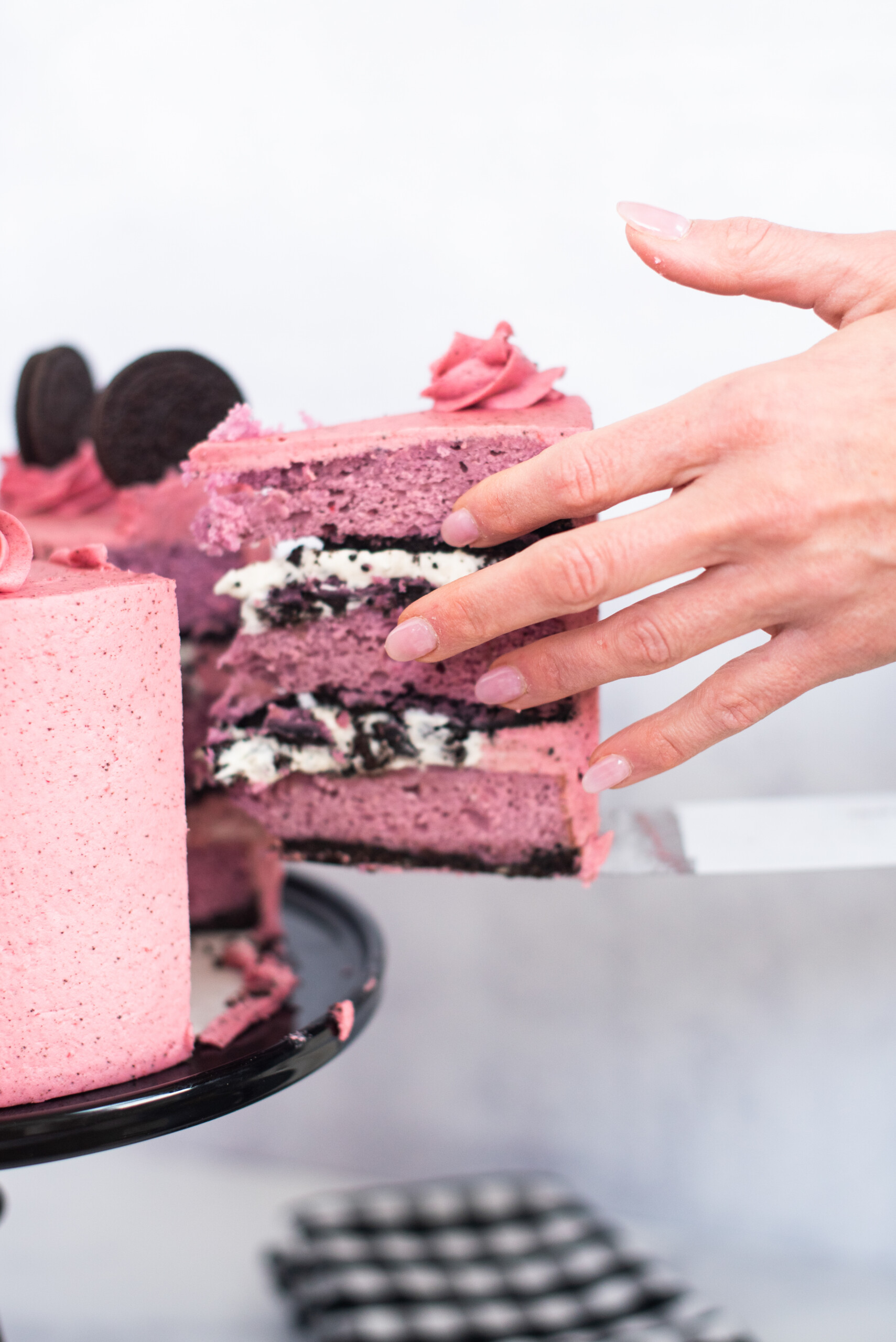 Woman cutting a slice of cake.