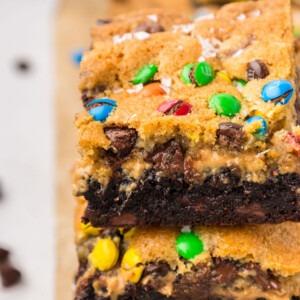 A stack of Monster Brookie Bars on a cutting board.