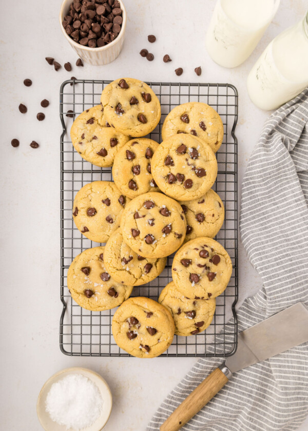 Chocolate chip cookies on a cooling rack.