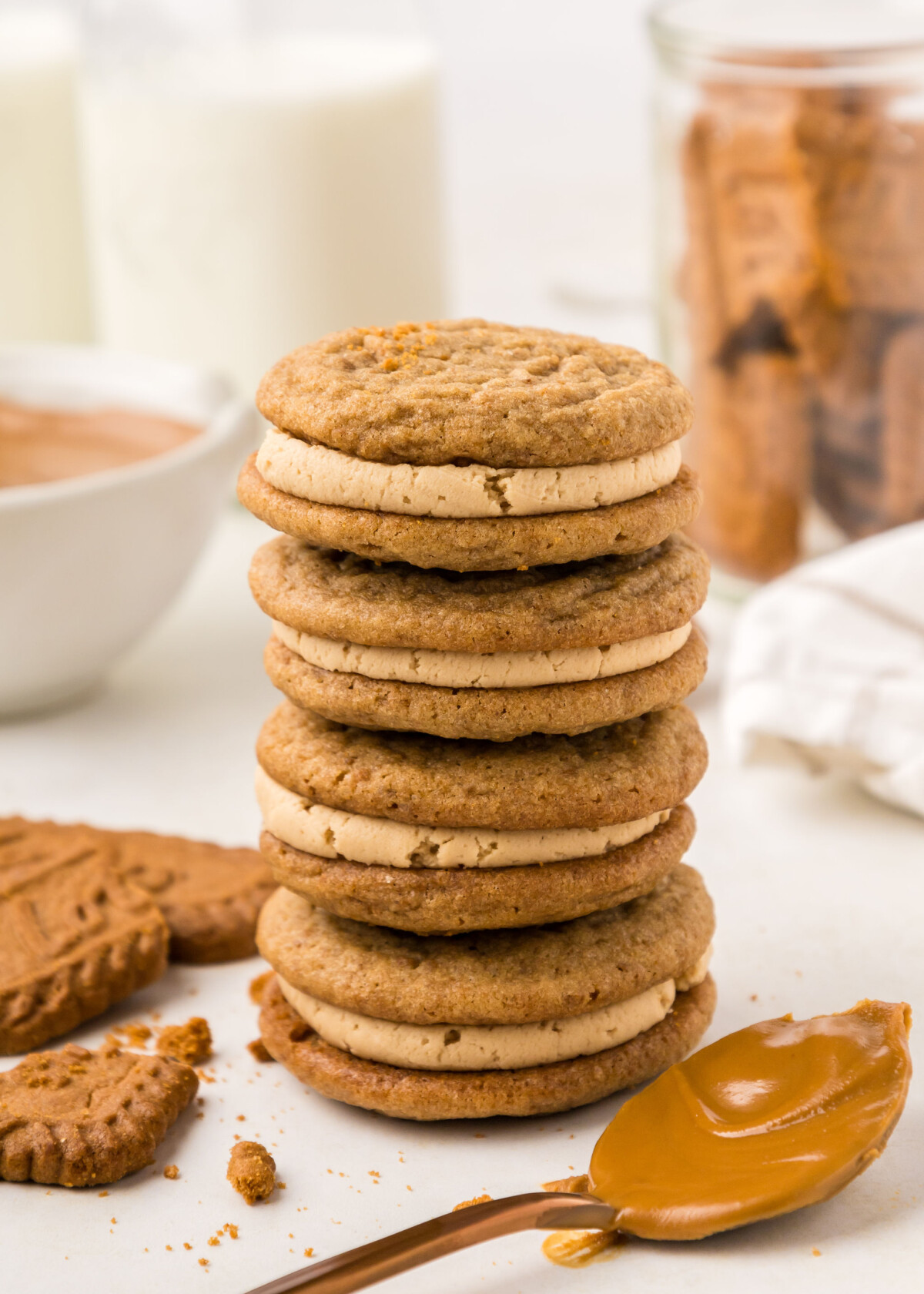 A stack of four biscoff sandwich cookies.