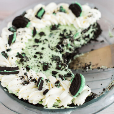 Grasshopper Pie Cake with a slice cut from the pie tin.