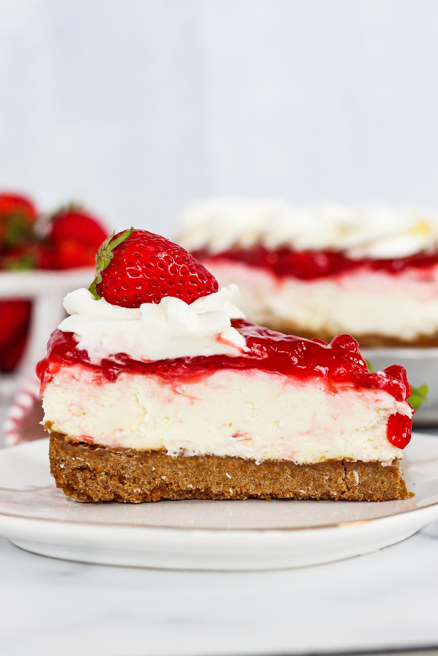 A slice of cheesecake on a plate.