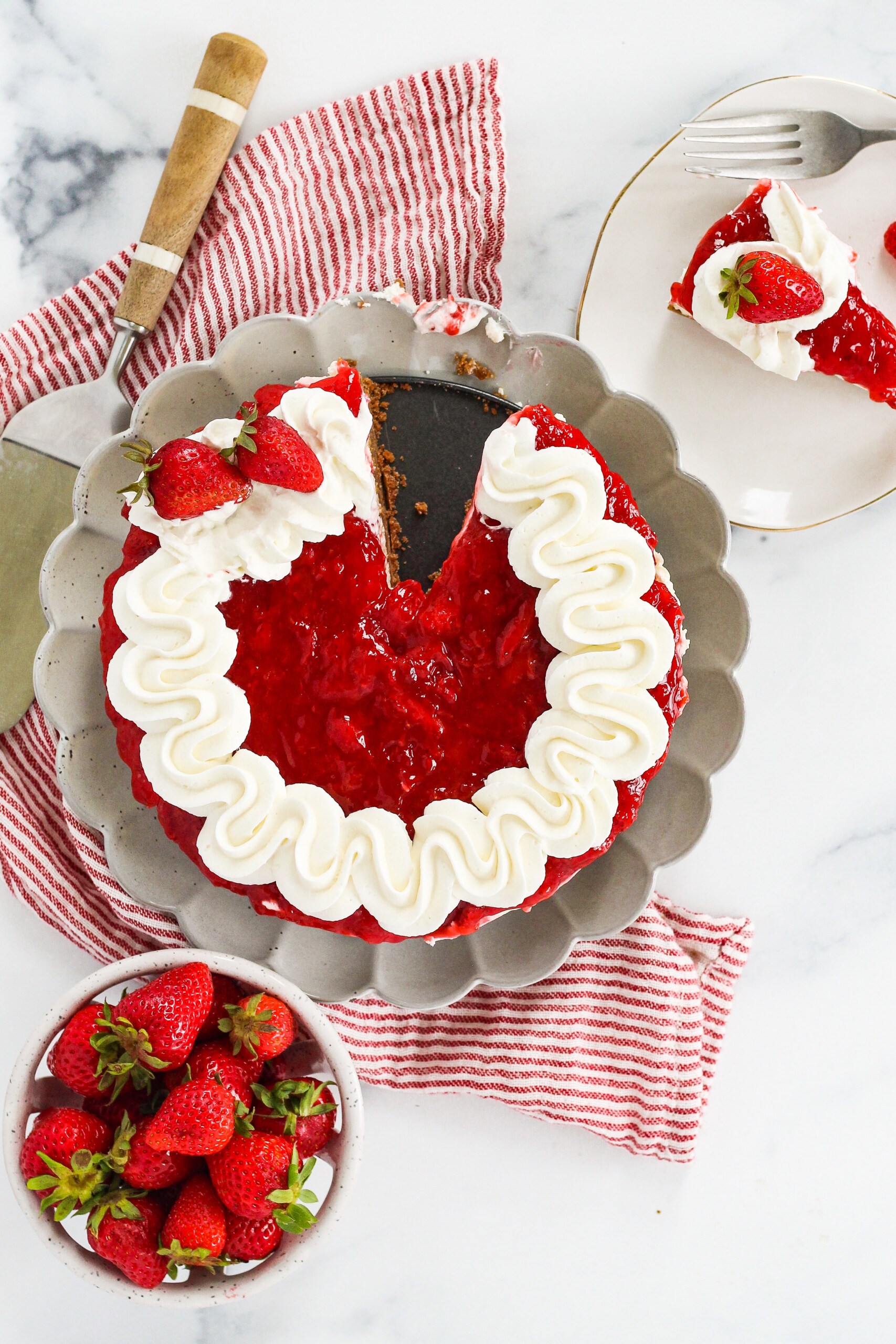 A no-bake cheesecake dessert with a slice taken out of it.