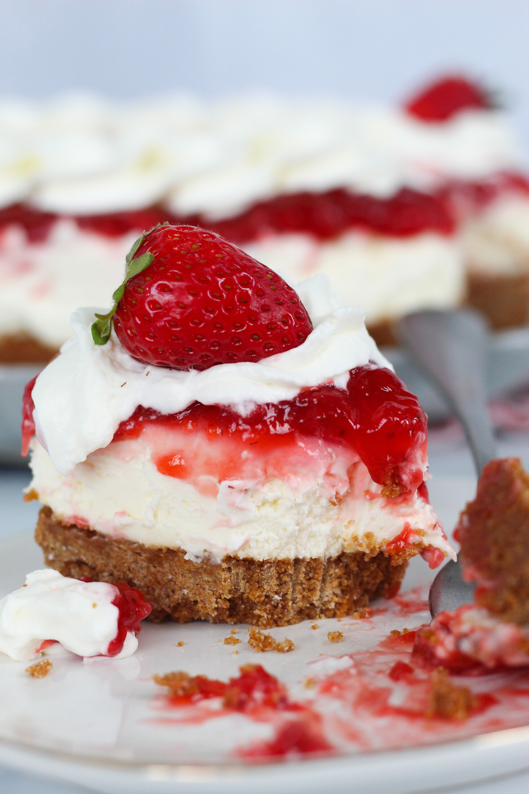 A half eaten slice of a no-bake cheesecake.