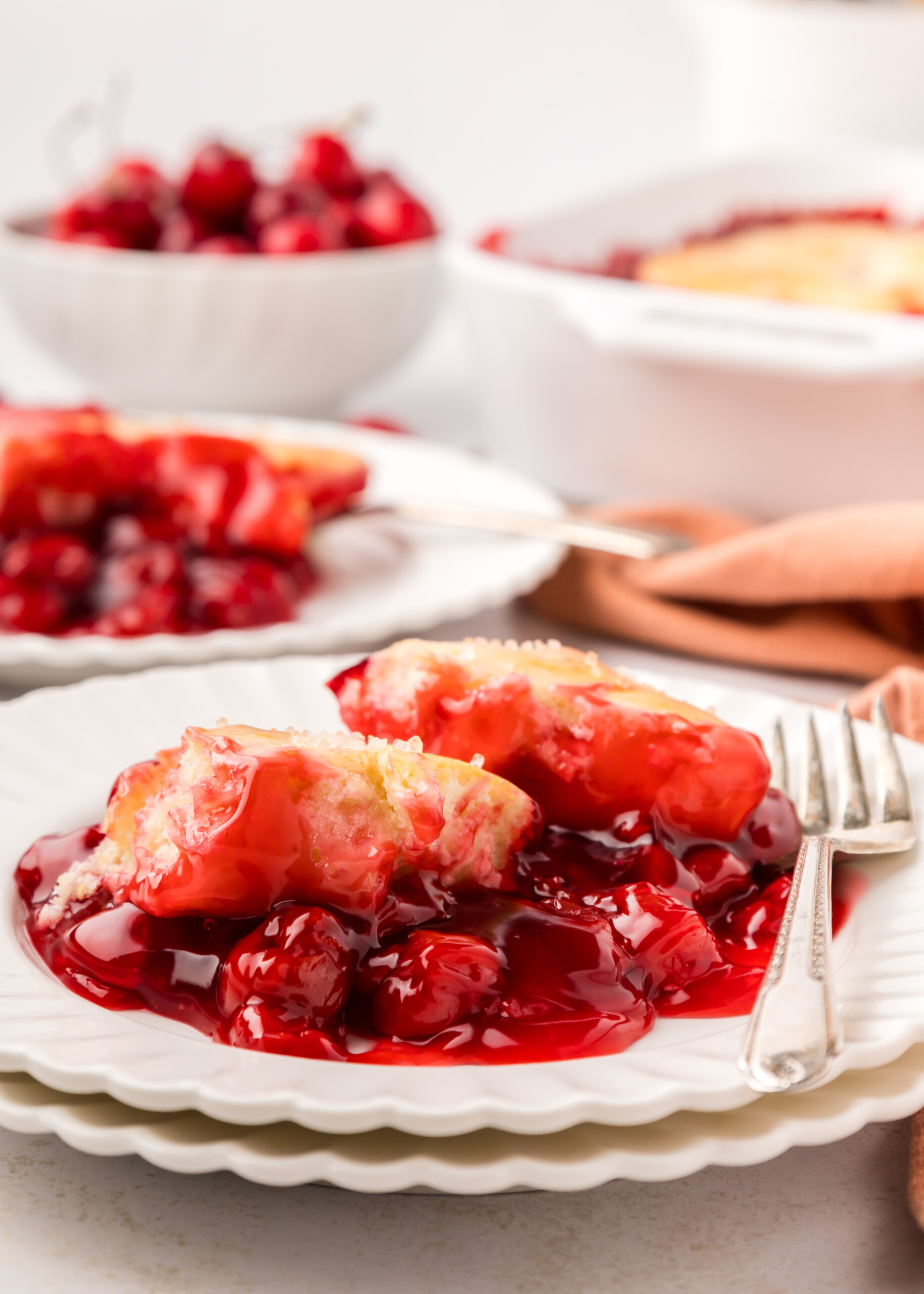 Cherry cobbler on a white plate.