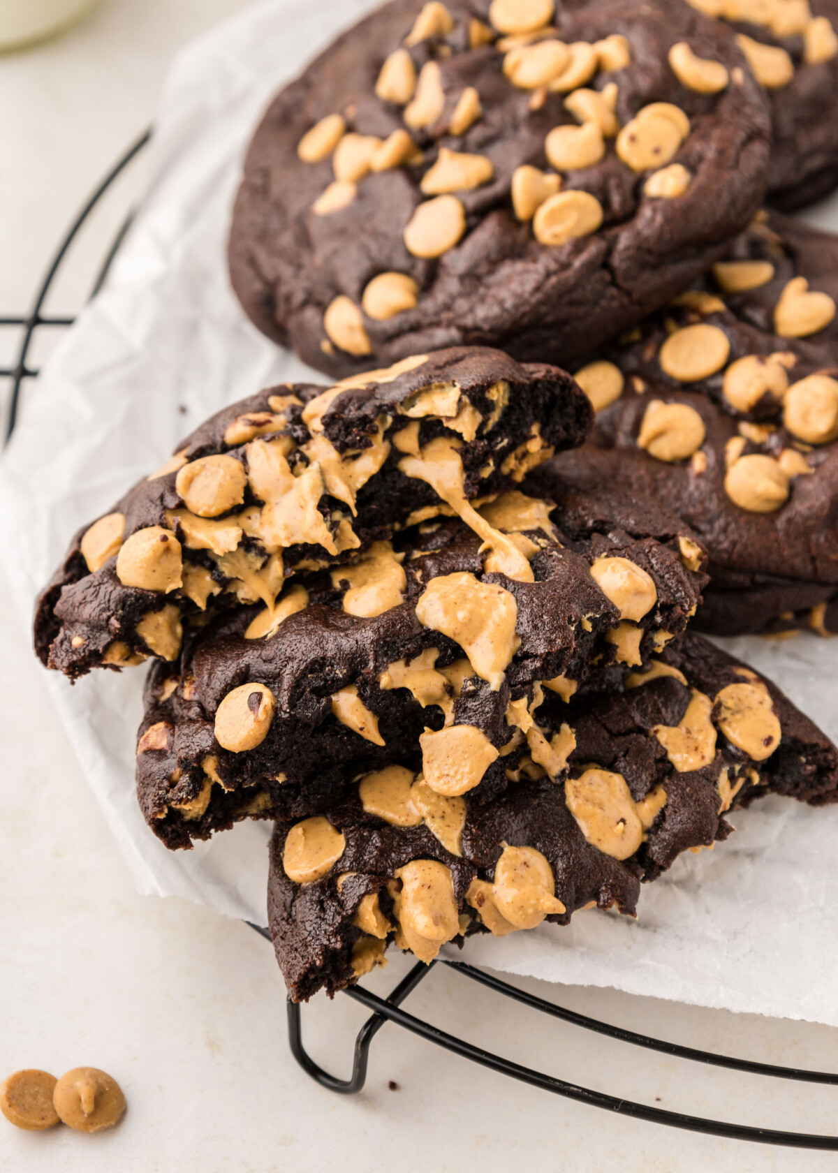 A plate of half pieces of chocolate peanut butter chip cookies.