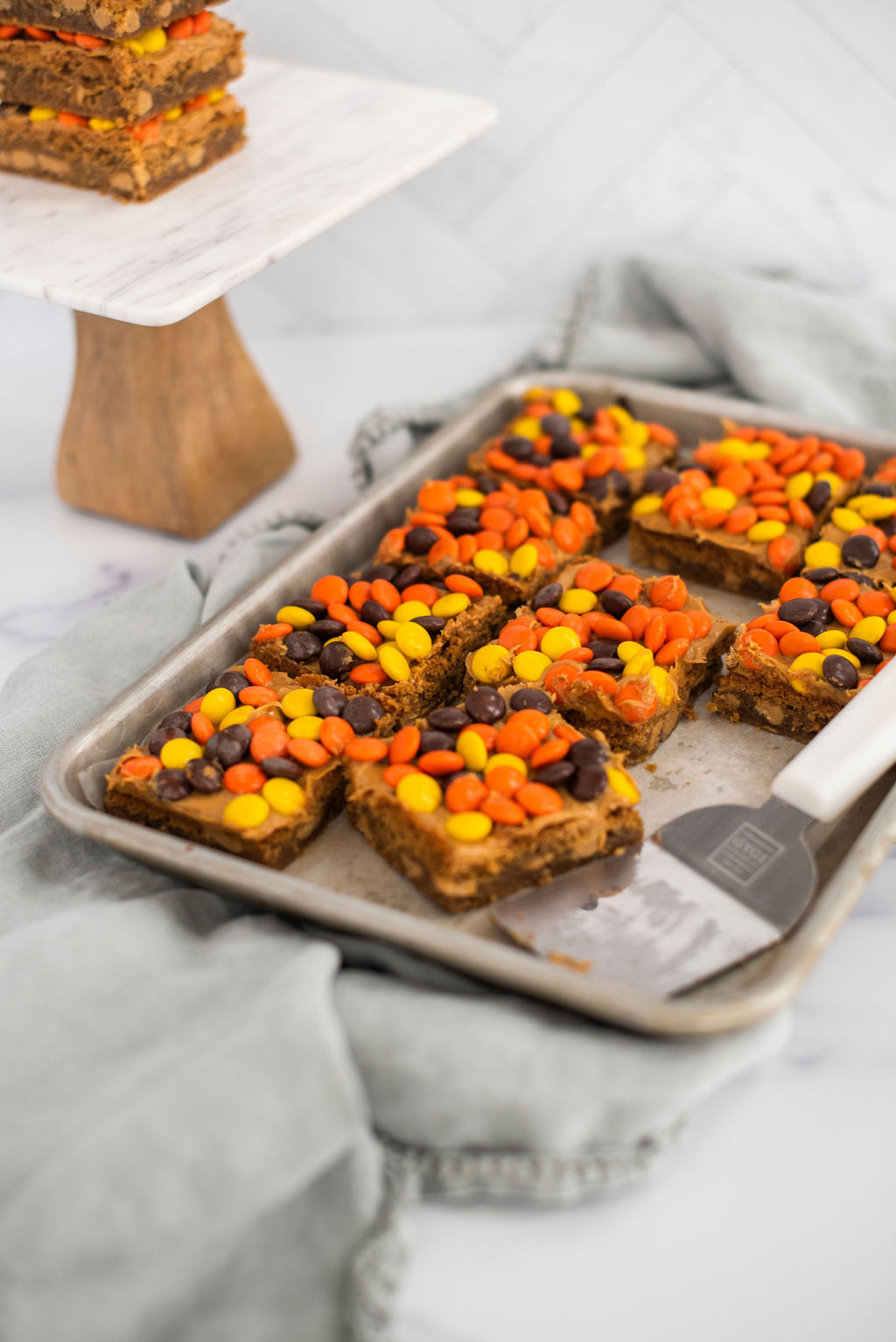 Peanut Butter Blondie bars on a baking sheet.