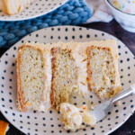 A slice of peanut butter banana cream cake with a bite taken out of it.