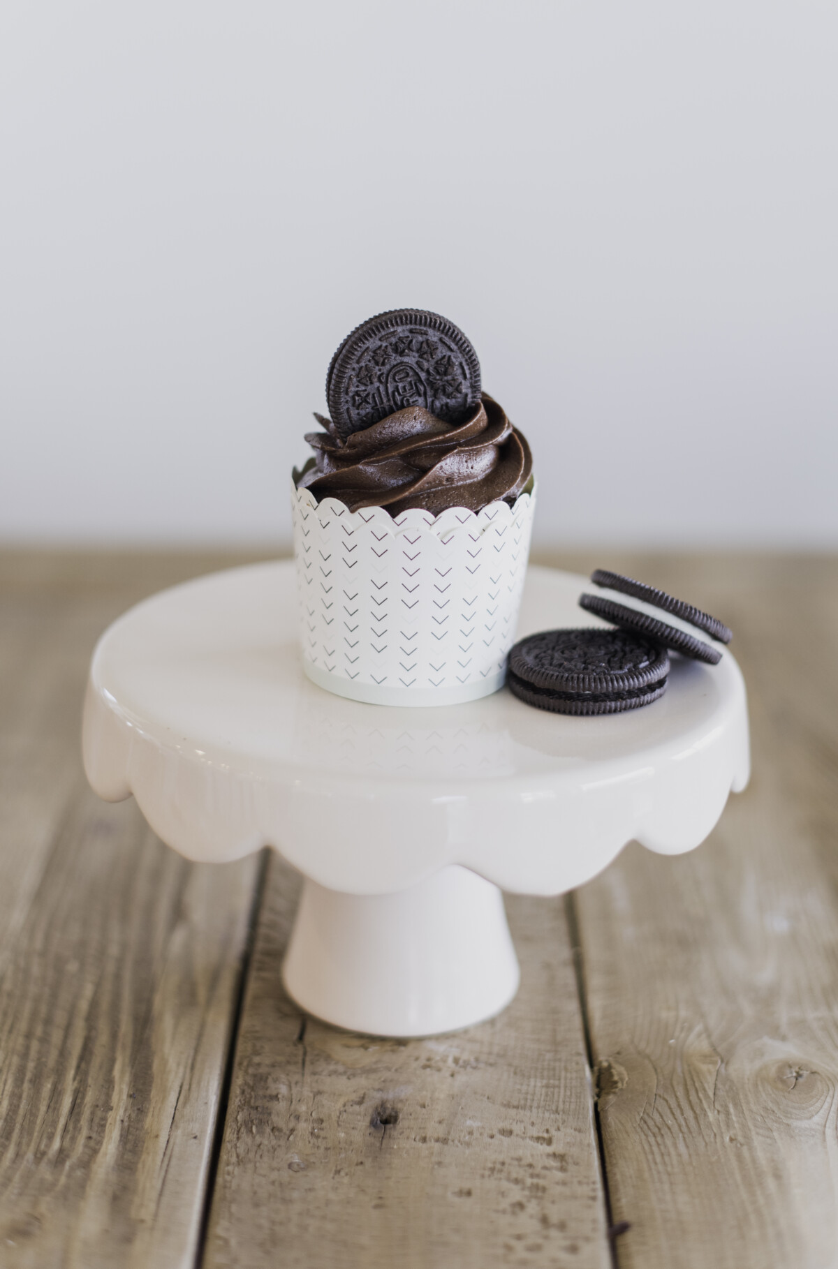 A cupcake on a cake stand.