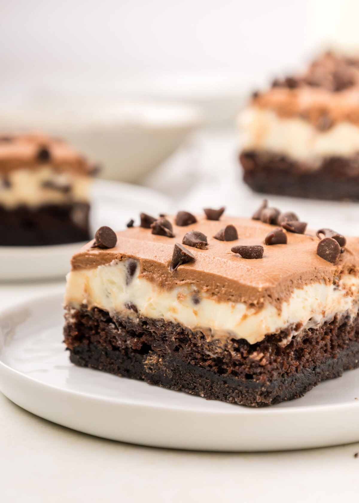 A chocolate cake bar on a plate.