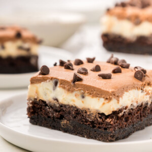 A chocolate cake bar on a plate.