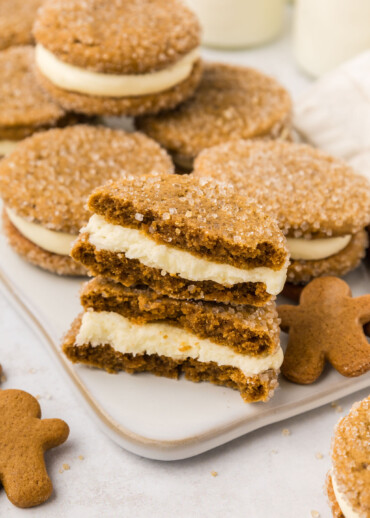 Gingerbread sandwich cookies split in half.